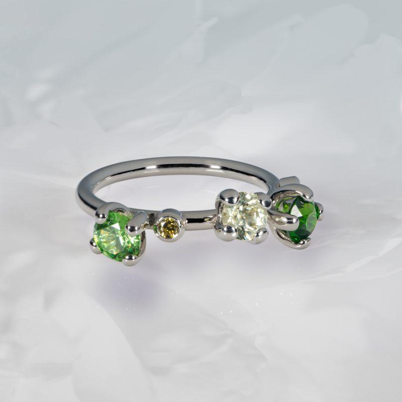 Green Demantoid Garnet, Diamond and Yellow Sapphire Peony ring in Platinum - by Cox & Power jewellers