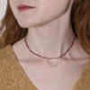 Model photo of a red spinel and diamond cube necklace
