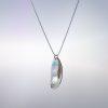 A Silver pedant with a Mother-of-Pearl shape nestled into the silver shape