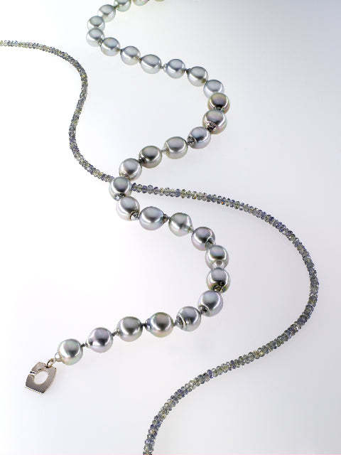 a silver-coloured pearl necklace with a pale grey faceted diamond bead necklace