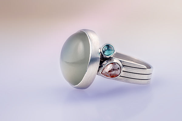 Moonstone and orange diamond ring with green tourmaline in Fairtrade and Fairmined platinum